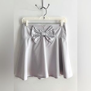 Women’s super adorable and feminine light gray skirt with a perfect front bow.